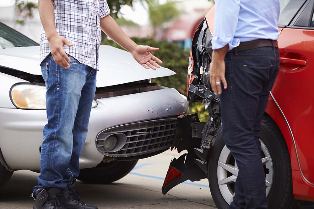 Two men talking after minor accident