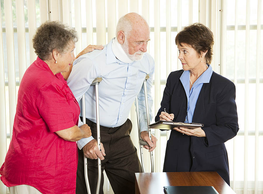 injured man on crutches with lawyer