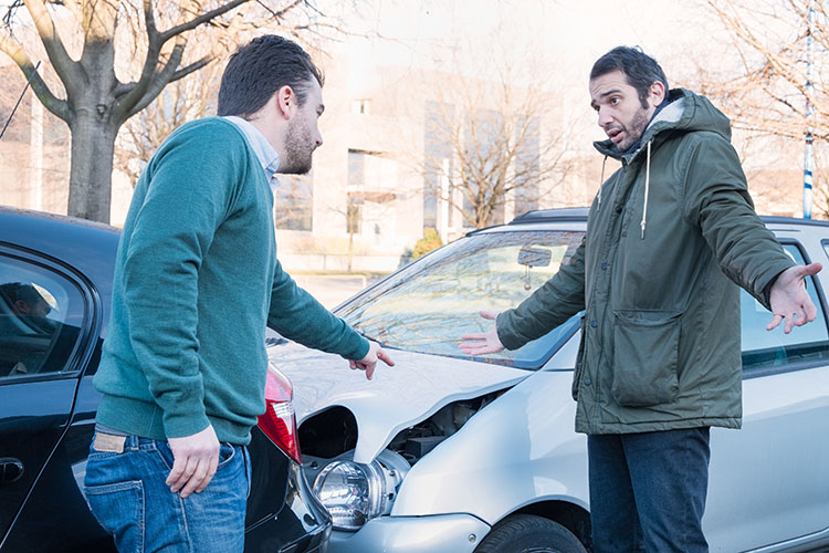 A person with road rage argues after an accident | Auto Accident Attorneys
